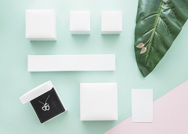 white packaging samples on a minimalist backdrop
