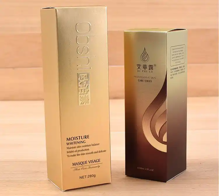 luxury metallic gold skincare packaging boxes with embossed and foil details